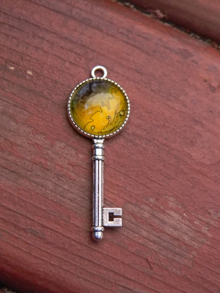 Pendentif oeuvre à porter clé