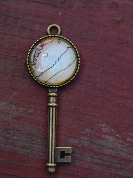 Pendentif oeuvre à porter clé