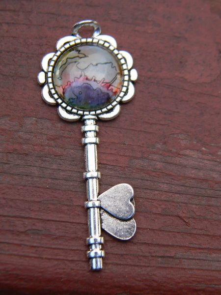 Pendentif oeuvre à porter clé